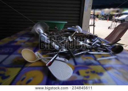 A Bowl Of Fork Is Placed On A Large Table.