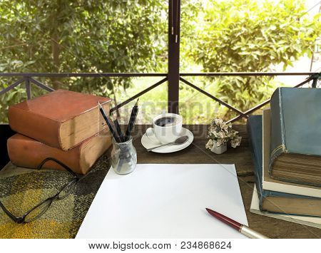 Old Books With Treatise, Glasses And Pencil On A Wooden Table In The Garden. Concept Education.