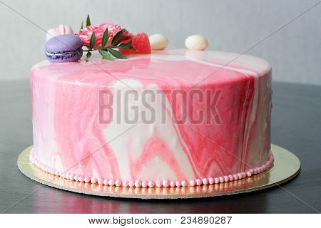 Tasty Pink Homemade Cake Decorated By Rose And Macarons. Marbelous Effect On Cake