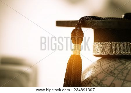 Graduate Study Abroad Concept, Graduation Cap On Top Earth Globe Model Map On Laptop With Radar Back