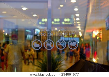 Information On The Glass At The Entrance Of Building For Information About Open And Close Time, And 