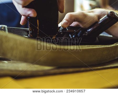 Man Disassemble Rifle Close Up On The Table