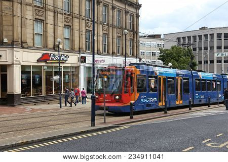 Sheffield, Uk - July 10, 2016: People Ride Stagecoach Supertram In Sheffield, Yorkshire, Uk. Sheffie