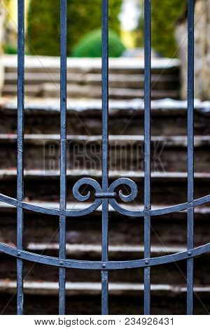 Stone Wall Entrance To A Garden, Security Closed Entrance Door.