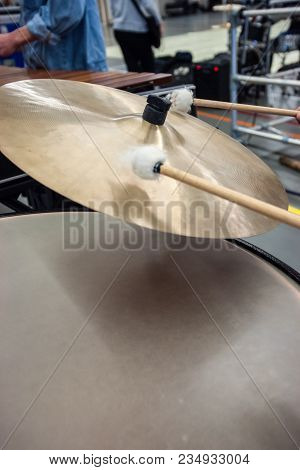 Musician Plays The Cymbals Of A Kettledrum With Drumstick