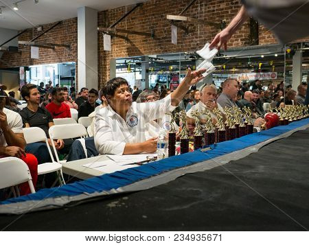 San Francisco, Ca - November 18, 2017: An Usa Boxing Official/judge Takes A Scoring Card From The Re