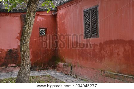 The Tree In Front Of An Old Histroic Traditional Building In The Unesco Listed Central Vietnamese To