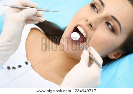 Young Female Patient Visiting Dentist Office.beautiful Woman With Healthy Straight White Teeth Sitti