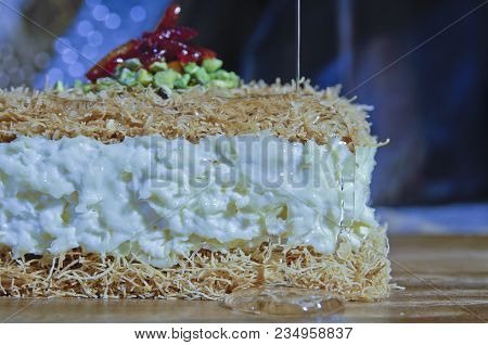 Pouring Syrup On Osmaliya, Arabic Sweets For Ramadan And Eid