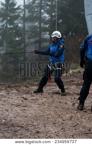 Rescue Man Helping Out On Land With Rope