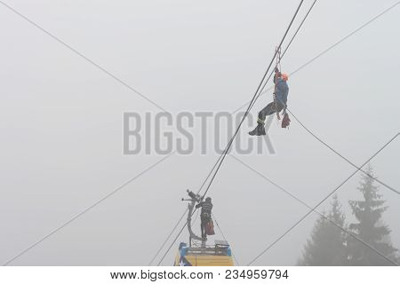 Alpinist Is Rescue People Exercise On Gondola Car
