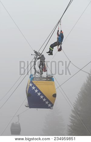 Alpinist Is Rescue People Exercise On Gondola Car