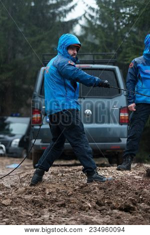 Rescue Man Helping Out On Land With Rope