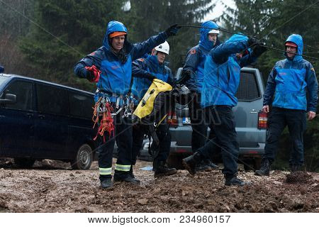 Rescue Man Helping Out On Land With Rope