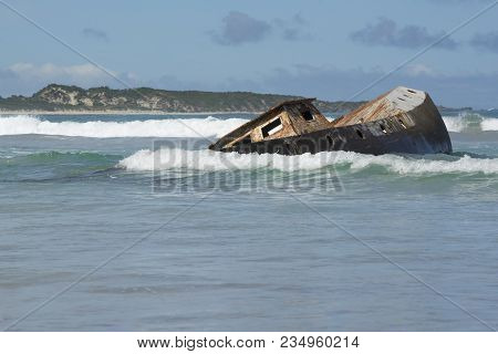 Boat Wreck Sunk And Battered By Ocean Waves At Carpenter Rocks, South Australia. Accessed Via The  C