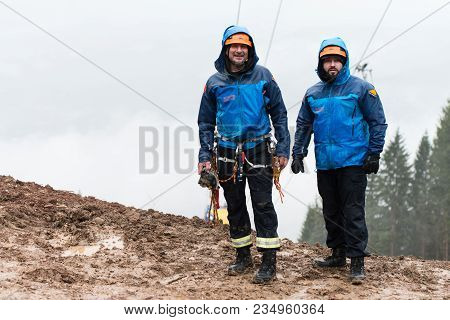 Rescue Man Helping Out On Land With Rope