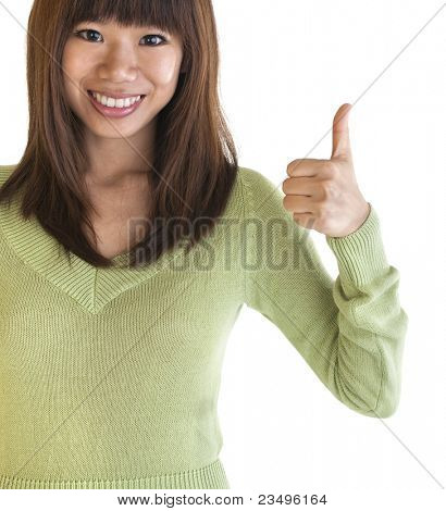 Young female giving thumbs up sign.