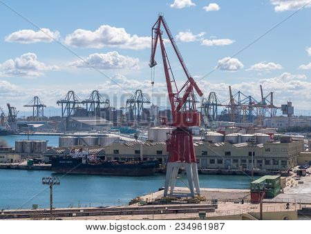 Valencia, Spain - March 16, 2018: Older Red Painted Crane On The Dockside In Valencia Spain