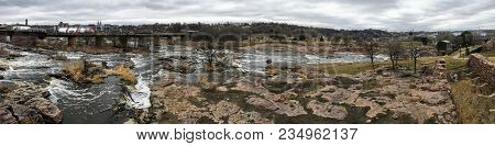 The Big Sioux River Flows Over Rocks In Sioux Falls South Dakota With Views Of Wildlife, Ruins, Park