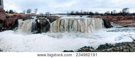 The Big Sioux River Flows Over Rocks In Sioux Falls South Dakota With Views Of Wildlife, Ruins, Park