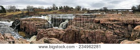 The Big Sioux River Flows Over Rocks In Sioux Falls South Dakota With Views Of Wildlife, Ruins, Park