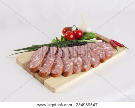 Still Life With Sliced Smoked Sausage Greens And Tomatoes On A White Background. Can Be Used For Ban