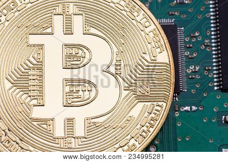 Cryptocurrency, Bitcoin Above Green Close Up. High Resolution Photo.