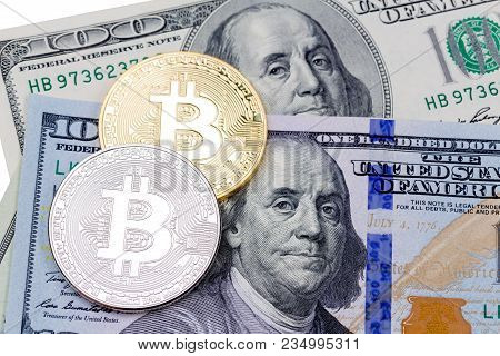 Golden And Silver Bitcoins On Us Dollars. Electronic Money Exchange Concept. High Resolution Photo.
