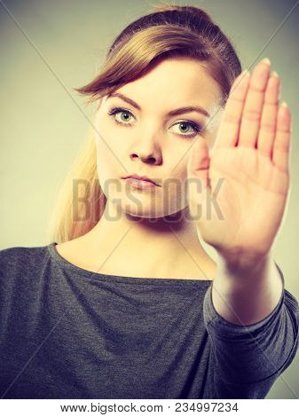 Prohibition Symbol. Serious Female Shows Stop Sign Talk To Hand Gesture. Angry Full Of Negative Emot