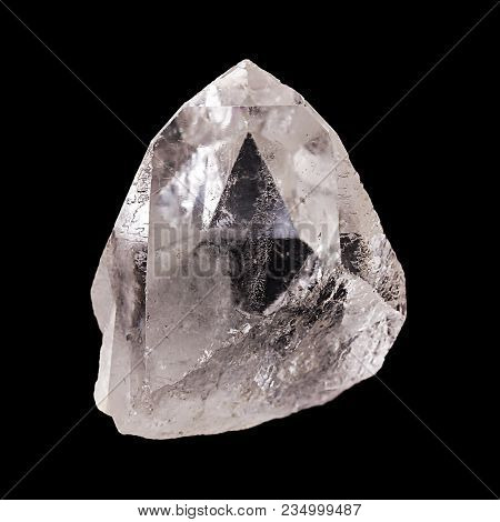Rough Quartz Crystal On Black Background. With Pyramid Shaped Optical Illusion Inside The Mineral. S
