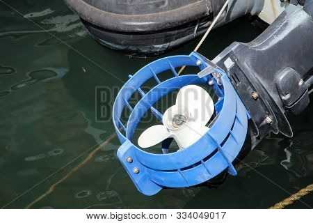 A Propeller Of A Motorboat Looks Out Of The Water