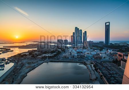 Sunset Over Abu Dhabi Skyline And The Downtown Modern Buildings View In The Uae Capital City