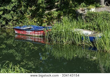 Rowing Boats In Stroudwater Navigation Canal, Stonehouse, Gloucestershire, Uk