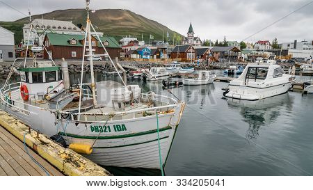 Husavik, Iceland - June 2019: Traditional Old Wooden Fisherman Boats Used For Whale Watching In Husa