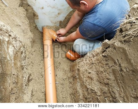 Supply Of A Sewer Pipe To A Sump By A Master Locksmith In The Countryside.