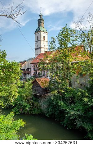 View Of Selca Sora River And St. Jacob Church In Skofja Loka, Slovenia
