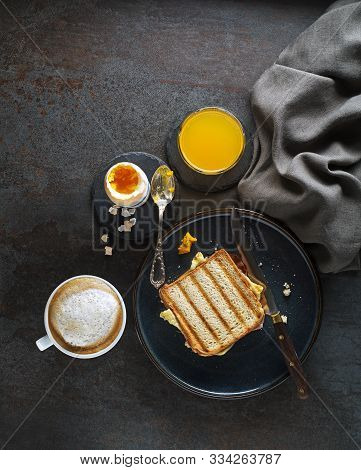 Breakfast Served With Coffee, Juice, Toast Sandwich And Boiled Egg. Delicious Healthy Breakfast.