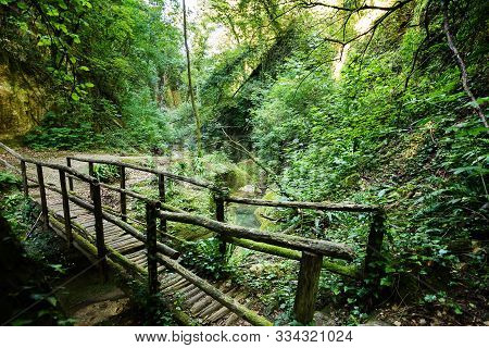 Valley Of The Alento River In Serramonacesca (italy): Wooden Bridge Over The River In A Lush Forest