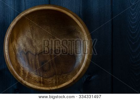 Bowl Of Wood On A Wooden Background.bowl Of Wood On A Wooden Background