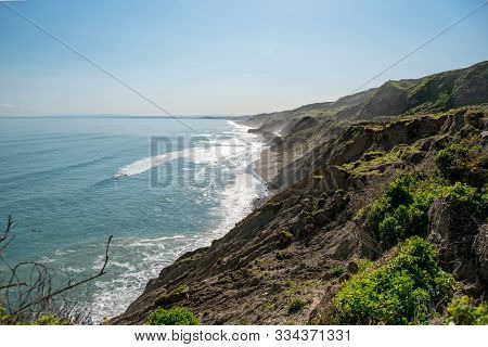The Dramatic Crumbling High Cliffs On The Scenic Gisborne Coastline On New Zealand