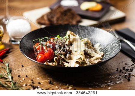 Black Angus pappardelle pasta with beef, champignon and parmegano cheese
