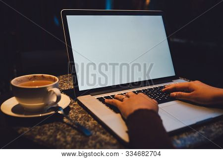 A Cup Of Cappuccino Coffee With Laptop White Screen On Table. Royalty High Quality Free Stock Photo 