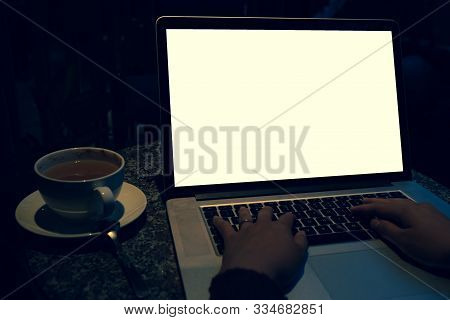 A Cup Of Cappuccino Coffee With Laptop White Screen On Table. Royalty High Quality Free Stock Photo 