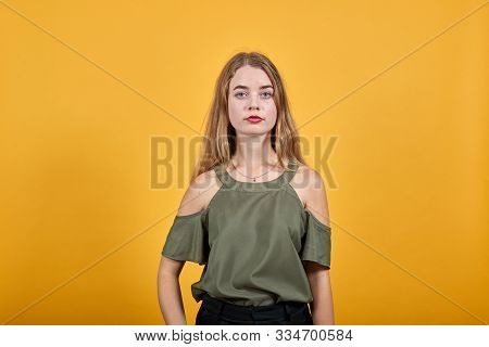 Young Funny Beautiful Caucasian Woman Wearing Nice Haki Fashion Shirt Puffing Cheeks With Funny Face