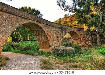 Old Stone Bridge Over Tuejar River In Chelva, Valencia