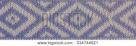 Background Of Grey Knitted Fabric. Home Made Stitchwork.