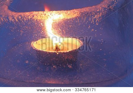 A Candle With Big Heart And Flame Burns In Twilight Time In A Frozen Lantern