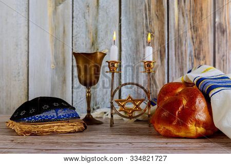 Shabbat Jewish Holiday With Challah Bread On A Candles And Cup Of Wine.