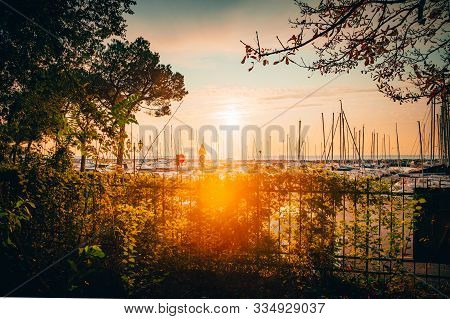 Dramatic Sunset At The Coast Of The Mediterranean Sea At The Sailing Harbor In Trieste, Italy, Near 