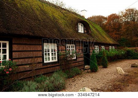 Marvelous Typical Farm House With Green Roof In Beautiful Summer Demark Village